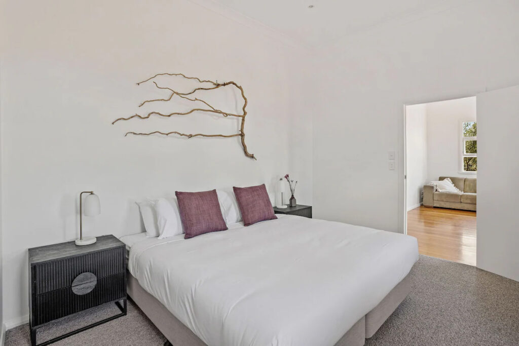 Personalised Painting Solutions located in Croydon, Victoria, painted the Interior of an old church in Whourouly that is an Airbnb, this is a photo of the interior painting in the Bedroom