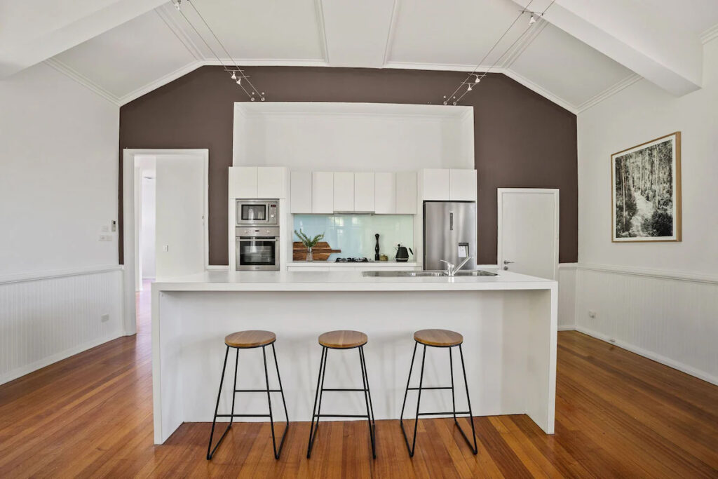 Personalised Painting Solutions located in Croydon, Victoria, painted the Interior of an old church in Whourouly that is an Airbnb, this is a photo of the kitchen